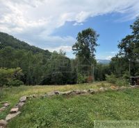 View from the family house in Kokava nad Rimavicou of the green landscape and forests.