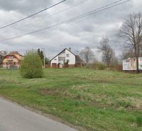 Land - housing in Poprad with visible family houses and billboards.