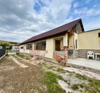A family house in Ľubotín with an unfinished facade and a concrete terrace.