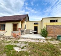 A family house in Ľubotín with a hallway, garage, and unfinished facade.