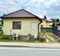 A family house in the village of Ľubotín with a gable roof and a fenced yard.