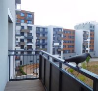 A balcony of a residential complex on Blumental Street in Bratislava with a garden view.