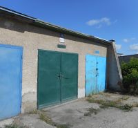 Garages on Ľudovíta Stárka Street in Trenčín, with blue and green doors.