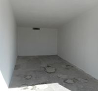 An empty concrete garage on Ľudovíta Stárka Street in Trenčín.
