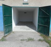 Open garages on Ľudovíta Stárka in Trenčín, with an empty interior and concrete floor.