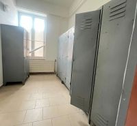 Interior of a production area with lockers and a window.