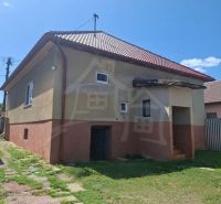 A family house in Ružiná with a gable roof and small windows.