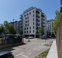 Apartment building on Agátová Street in Bratislava - Dúbravka with a parking zone and greenery.