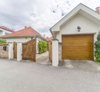 A family house on Čigérska Street in Dunajská Streda with a wooden gate.