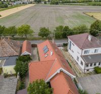 A family house on Čigérska Street in Dunajská Streda next to a vast field.
