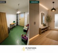 The entrance hall in a 2-room apartment with a wooden decor floor and modern furniture.