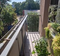 A balcony with a view of greenery and buildings, 4-room apartment, Hradná, Komárno.
