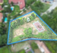 Aerial footage shows a plot of land on Krátka Street in Limbach, suitable for living.