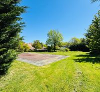 Plots - residential on Krátka Street in Limbach with lawn and trees.