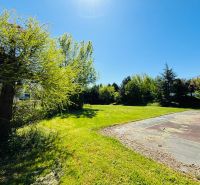 Sunny plot on Krátka Street in Limbach. Residential land surrounded by greenery.