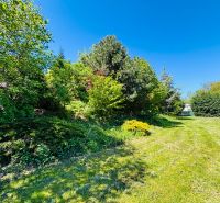 Plots - residential on Krátka Street in Limbach with rich vegetation and lawn.