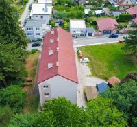 Building with a red roof and surroundings on Dimitrovova Street in Handlová, near a 2-room apartment.