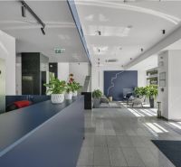 Reception with vases of green plants in the offices at the Westend Tower building.