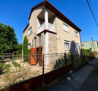 A family house on Mládežnícka Street in Šahy with stone cladding and a garden.