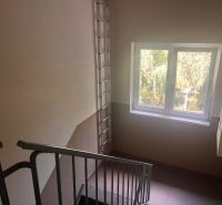 Staircase with metal railing and a window with a view, Kežmarok, Gen. Štefánika.