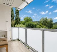 A balcony with a view of greenery in a 1-room apartment, Považská Bystrica, SNP street.