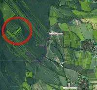 Aerial view of agricultural and forest lands in Veľké Ozorovce with a marked area.