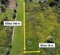 Residential plots in Bátorové Kosihy with greenery and visible dimensions.