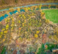 Aerial view of nature by the river in the town of Muľa, Land - residential.