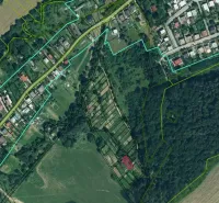 Aerial view of gardens in Bystré with forest and agricultural areas.
