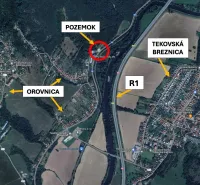 Aerial photograph over Special Properties in Orovnica, highlighting the land, river, and road R1.