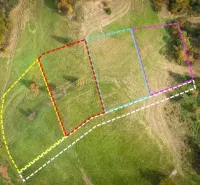 Aerial view of parceled land in Banská Štiavnica, surrounded by greenery, Unique properties.