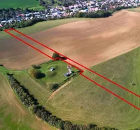 Aerial view of agricultural and forest land near Trenčianske Stankovce, bordered by a red line.