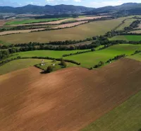 Meadows and fields on agricultural and forest lands in Trenčianske Stankovce under the mountains.