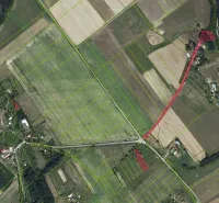 Aerial view of agricultural and forest land around the village of Muľa.