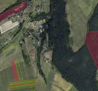 Aerial view of agricultural and forest lands around the village of Muľa.