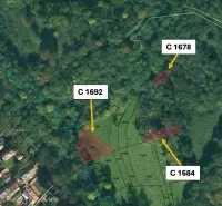 Aerial view of agricultural and forest lands in Ratkovské Bystré with parcels.
