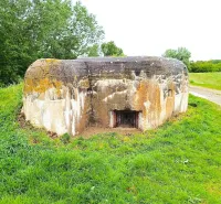 Unusual real estate in Malacky: An old military bunker surrounded by greenery in a natural environment.
