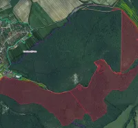 Aerial view of agricultural and forest land surrounding Plavecký Peter, visible topography.