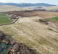 Agricultural and forest lands in Podhorany, with beautiful hilly landscapes and pastures.