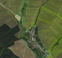Aerial view of Barca with peculiar properties and surrounding fields.