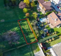 Aerial view of green gardens in Banská Bystrica with a highlighted plot.