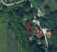 Aerial view of unusual properties in Prašník with marked parcels and roads.