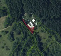 Aerial view of unusual properties in Krupina, surrounded by forests and plots.