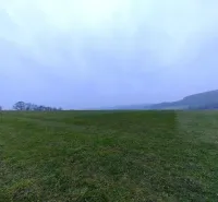 A vast green field in Podkylava surrounded by gently rolling landscape, Unique properties.