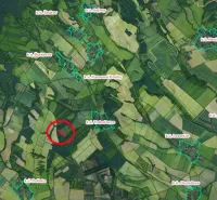 Aerial view of agricultural and forest lands around Trebušovce, marked area.