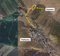 Aerial view of agricultural and forest land in Podhorany with a marked plot.