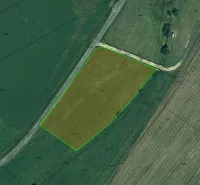 Aerial view of agricultural and forest land in the village of Podhorany.
