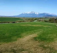 Agricultural and forest land in Podhorany with views of the mountains and green meadows.