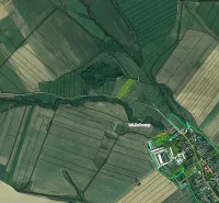 Aerial view of agricultural and forest lands around Podhorany.