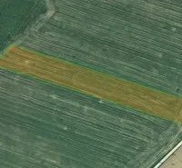 Aerial view of agricultural and forest land in Podhorany with the highlighted parcel.